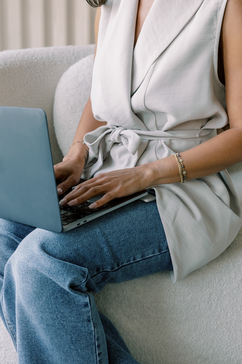 A woman working on a laptop at home